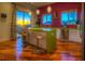 Modern kitchen with a unique green island and stainless steel appliances at 36879 N 38Th St, Cave Creek, AZ 85331