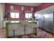 Bright kitchen featuring modern appliances, a center island, and wooden floors at 36879 N 38Th St, Cave Creek, AZ 85331