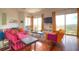 Open-concept living room with hardwood floors and large windows showcasing mountain views at 36879 N 38Th St, Cave Creek, AZ 85331