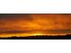 Golden sunset with dark clouds over silhouetted mountains at 36879 N 38Th St, Cave Creek, AZ 85331
