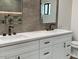 Bathroom featuring double sinks, quartz counters, and modern fixtures at 3933 E Rancho Dr, Paradise Valley, AZ 85253