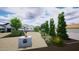 Beautiful home with a manicured landscape, outdoor fireplace, and desert-friendly plants at 3933 E Rancho Dr, Paradise Valley, AZ 85253