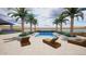 Beautiful pool with lounge chairs and tropical landscaping, perfect for relaxation at 3933 E Rancho Dr, Paradise Valley, AZ 85253