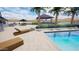 Backyard pool area featuring an outdoor kitchen and fireplace at 3933 E Rancho Dr, Paradise Valley, AZ 85253