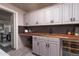 Chic bar area featuring custom cabinets, wood countertop, wine storage, and stylish finishes at 3977 E Paradise View Dr, Paradise Valley, AZ 85253
