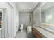 Modern bathroom features a large vanity, toilet and walk-in shower with gold shower fixtures at 3977 E Paradise View Dr, Paradise Valley, AZ 85253