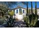 Beautiful exterior featuring a white facade, unique architectural details, and desert landscaping at 3977 E Paradise View Dr, Paradise Valley, AZ 85253