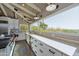 Bright, modern kitchen featuring white cabinets, stainless steel appliances, and expansive granite countertops at 3977 E Paradise View Dr, Paradise Valley, AZ 85253