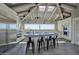 Modern kitchen with granite countertops, stainless steel appliances, island seating, and natural light at 3977 E Paradise View Dr, Paradise Valley, AZ 85253