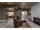Living area with hardwood floors, fireplace, wet bar, and office space at 3977 E Paradise View Dr, Paradise Valley, AZ 85253