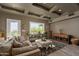 Cozy living room with a comfortable sofa, decorative rug, and natural light at 3977 E Paradise View Dr, Paradise Valley, AZ 85253