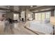 Spacious main bedroom with fireplace, ensuite bathroom, hardwood floors, and exterior views at 3977 E Paradise View Dr, Paradise Valley, AZ 85253