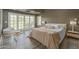 Bright bedroom with hardwood floors, many windows, and calming decor at 3977 E Paradise View Dr, Paradise Valley, AZ 85253