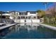 Backyard pool with an in-ground spa and lounge chairs, perfect for relaxing and entertaining at 3977 E Paradise View Dr, Paradise Valley, AZ 85253