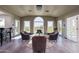 Bright sitting area with hardwood floors, comfortable chairs, and exterior views at 3977 E Paradise View Dr, Paradise Valley, AZ 85253