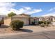 Charming beige single-story home with a two-car garage and desert landscaping at 43639 W Blazen Trl, Maricopa, AZ 85138