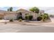 Beige single-story home featuring desert landscaping and a tile roof at 43639 W Blazen Trl, Maricopa, AZ 85138