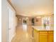 Open-concept living area with access to the backyard and adjacent kitchen at 43639 W Blazen Trl, Maricopa, AZ 85138