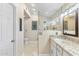 Bright bathroom featuring a shower, vanity with granite countertops, and modern fixtures at 4502 E Hartford Ave, Phoenix, AZ 85032