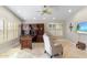 Bright home office featuring custom built-ins, tile floor, recessed lighting, and plantation shutters at 4502 E Hartford Ave, Phoenix, AZ 85032