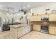 Open-concept kitchen with a large island, granite countertops, stainless steel appliances, and neutral cabinetry at 4502 E Hartford Ave, Phoenix, AZ 85032