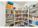 Well-organized pantry with shelves stocked with food and household essentials at 4502 E Hartford Ave, Phoenix, AZ 85032