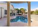 Beautiful backyard pool area with rock waterfall feature, palm trees, hot tub and patio at 4502 E Hartford Ave, Phoenix, AZ 85032