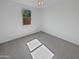 Clean bedroom with gray carpet, a window offering natural light, and neutral walls at 4806 N 186Th Ln, Goodyear, AZ 85395