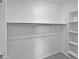 Walk in closet featuring shelving and a closet rod for storage at 4806 N 186Th Ln, Goodyear, AZ 85395