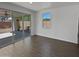 Bright living room featuring hardwood floors, a window and sliding glass doors to the patio at 4806 N 186Th Ln, Goodyear, AZ 85395