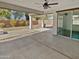 Covered patio overlooking the backyard and includes a ceiling fan for comfort at 4806 N 186Th Ln, Goodyear, AZ 85395