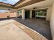 Large covered patio overlooking the landscaped backyard, featuring a ceiling fan at 4806 N 186Th Ln, Goodyear, AZ 85395