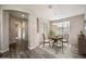 Elegant dining area with stylish chandelier, neutral tones, and wood-look flooring at 5628 S Winchester --, Mesa, AZ 85212