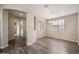 Bright dining area with an elegant lighting fixture and wood floors at 5628 S Winchester --, Mesa, AZ 85212