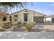 Charming single-story home with a well-manicured front yard and neutral exterior paint at 5628 S Winchester --, Mesa, AZ 85212