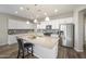 Bright kitchen with stainless steel appliances and a granite countertop island at 5628 S Winchester --, Mesa, AZ 85212