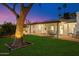 Inviting backyard showcasing a covered patio with outdoor seating and lush green space, perfect for relaxing outdoors at 623 E Winter Drive Dr, Phoenix, AZ 85020