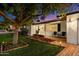 Inviting front porch featuring a brick walkway and flower beds with a large shade tree at 623 E Winter Drive Dr, Phoenix, AZ 85020