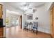 Bright eat-in kitchen with wood floors and views to the backyard pool through french doors at 623 E Winter Drive Dr, Phoenix, AZ 85020