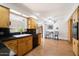 An inviting kitchen featuring oak cabinets, black countertops, and modern appliances at 623 E Winter Drive Dr, Phoenix, AZ 85020