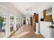 Bright sunroom with multiple french doors to backyard and an open layout to dining room at 623 E Winter Drive Dr, Phoenix, AZ 85020