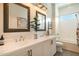 Bright bathroom with a double vanity, framed mirrors, and stylish fixtures at 6858 E Orion Dr, Scottsdale, AZ 85257
