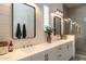 Bathroom with double vanity, modern fixtures, large mirrors, and walk in shower at 6858 E Orion Dr, Scottsdale, AZ 85257