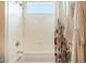 Clean bathroom featuring a shower/tub with a floral curtain and white interior at 6858 E Orion Dr, Scottsdale, AZ 85257