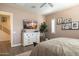 Inviting bedroom with a dresser, TV, and hardwood floors at 6858 E Orion Dr, Scottsdale, AZ 85257