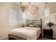 Charming bedroom with a modern accent wall, plantation shutters, and a cozy bed at 6858 E Orion Dr, Scottsdale, AZ 85257
