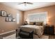 Cozy bedroom featuring a plush bed, natural light, and neutral color palette at 6858 E Orion Dr, Scottsdale, AZ 85257