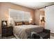 Bedroom featuring a plush bed, natural light, and ensuite bathroom at 6858 E Orion Dr, Scottsdale, AZ 85257