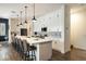 Bright, open kitchen with white cabinets, stainless steel appliances, and a large island with seating at 6858 E Orion Dr, Scottsdale, AZ 85257