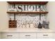Kitchen details: Open shelving and modern farmhouse decor create a cozy and functional workspace at 6858 E Orion Dr, Scottsdale, AZ 85257